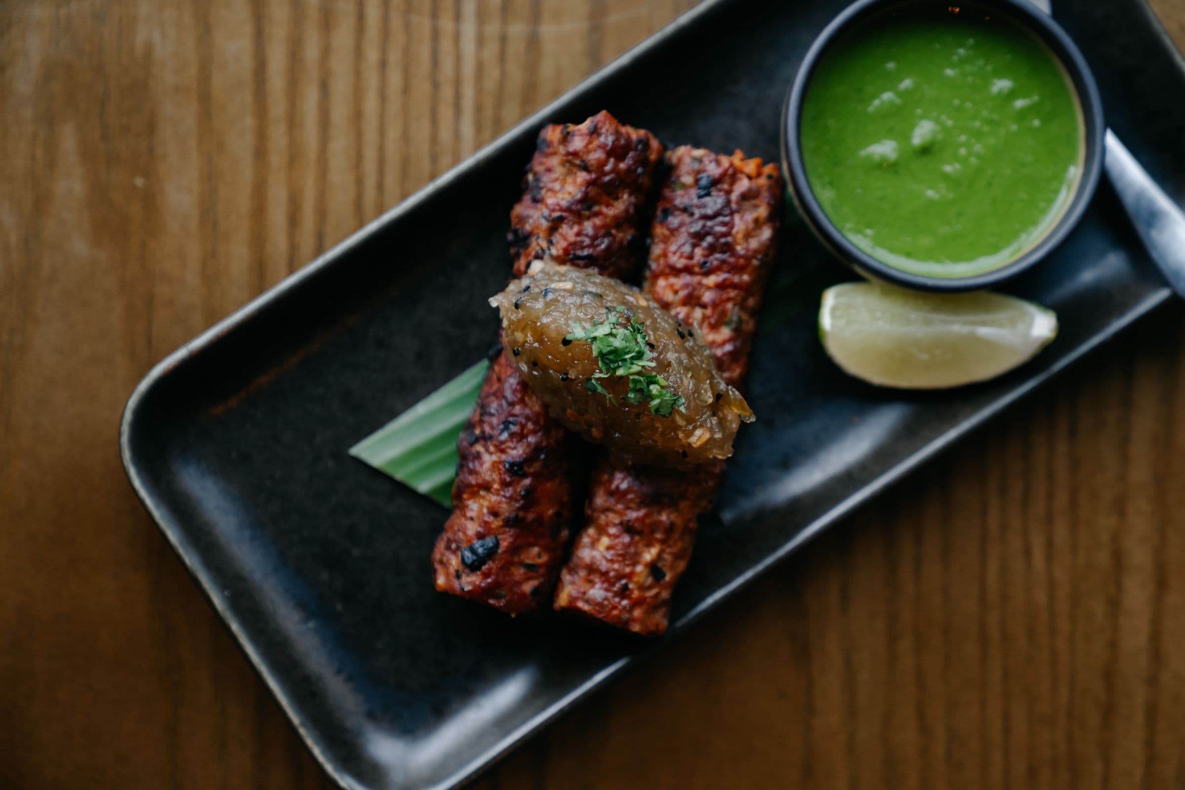 Tandoori dish with cocktail at Koyal Indian Restaurant Surbiton